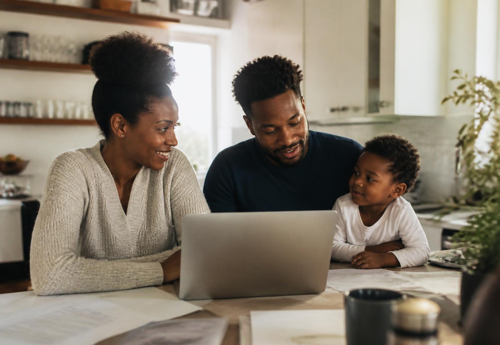 A family reviewing plans together at their kitchen table